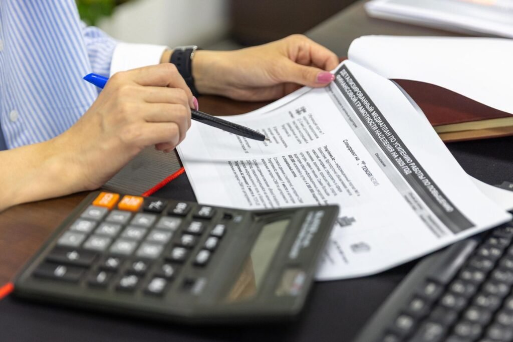 Reviewing figures with a calculator and printed statements